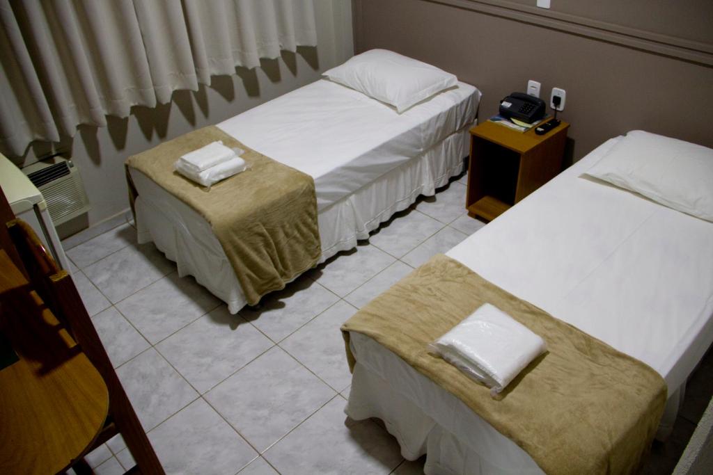 Postel nebo postele na pokoji v ubytování Presidente Hotel