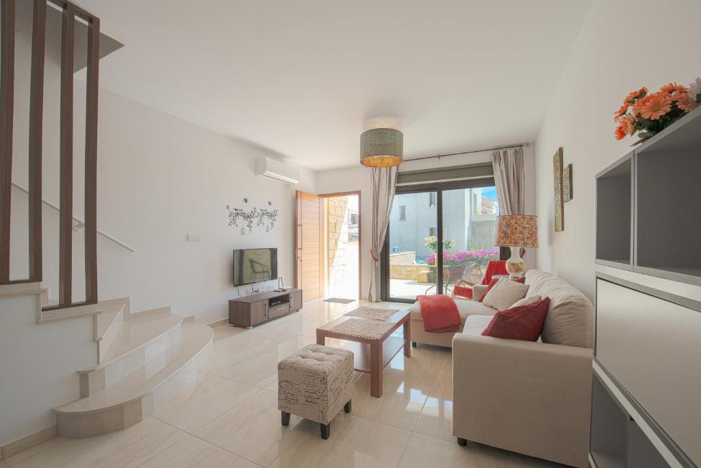 a living room with a couch and a table at Kolderen Coral Bay 3 in Coral Bay