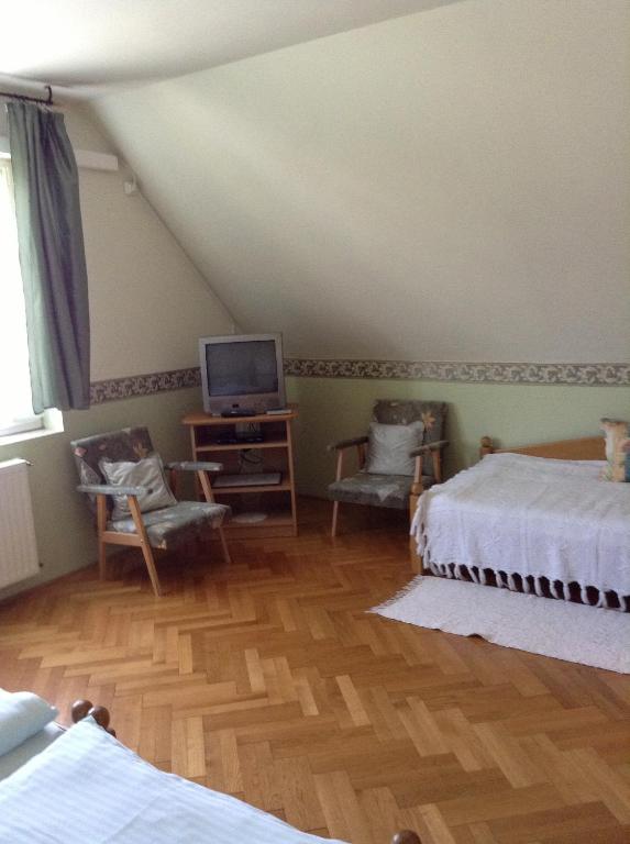 Postel nebo postele na pokoji v ubytování Főnix Fogadó