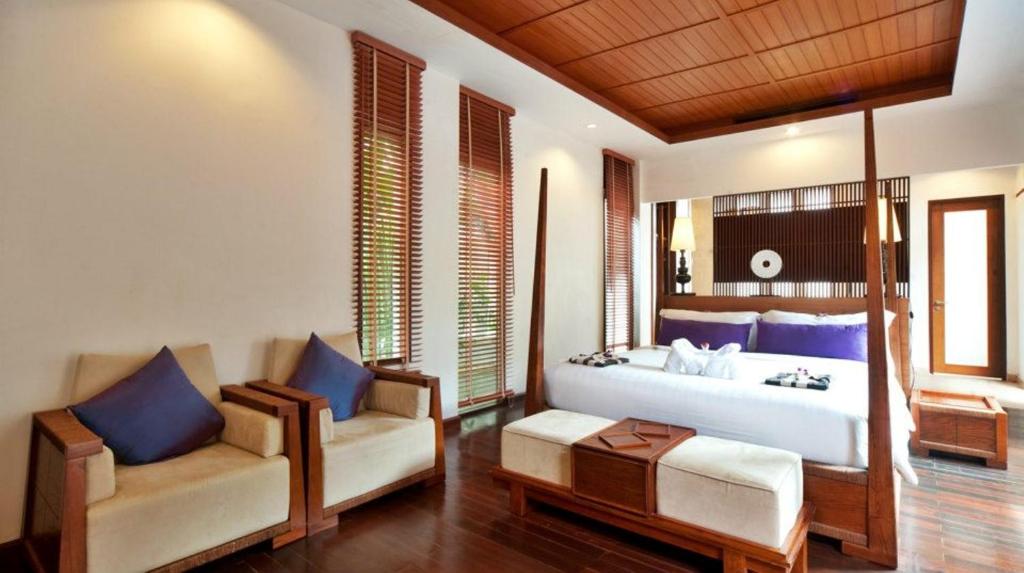 Postel nebo postele na pokoji v ubytování The Sarann, Koh Samui - Suites & Villas