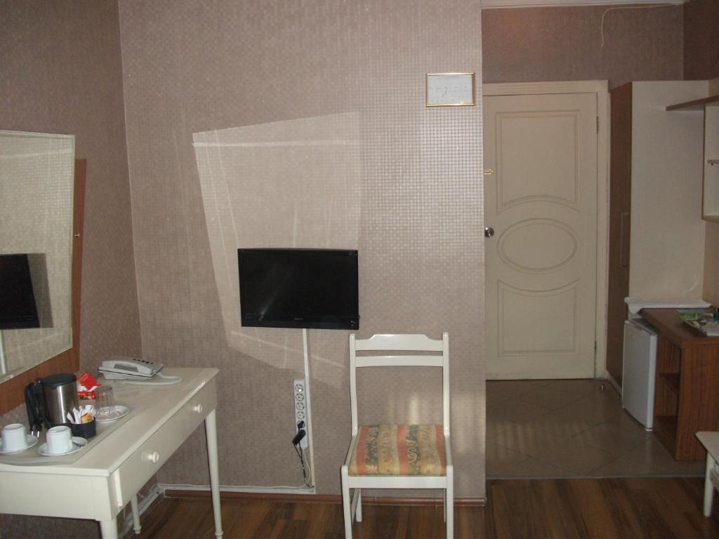 TV a/nebo společenská místnost v ubytování Tac Hotel