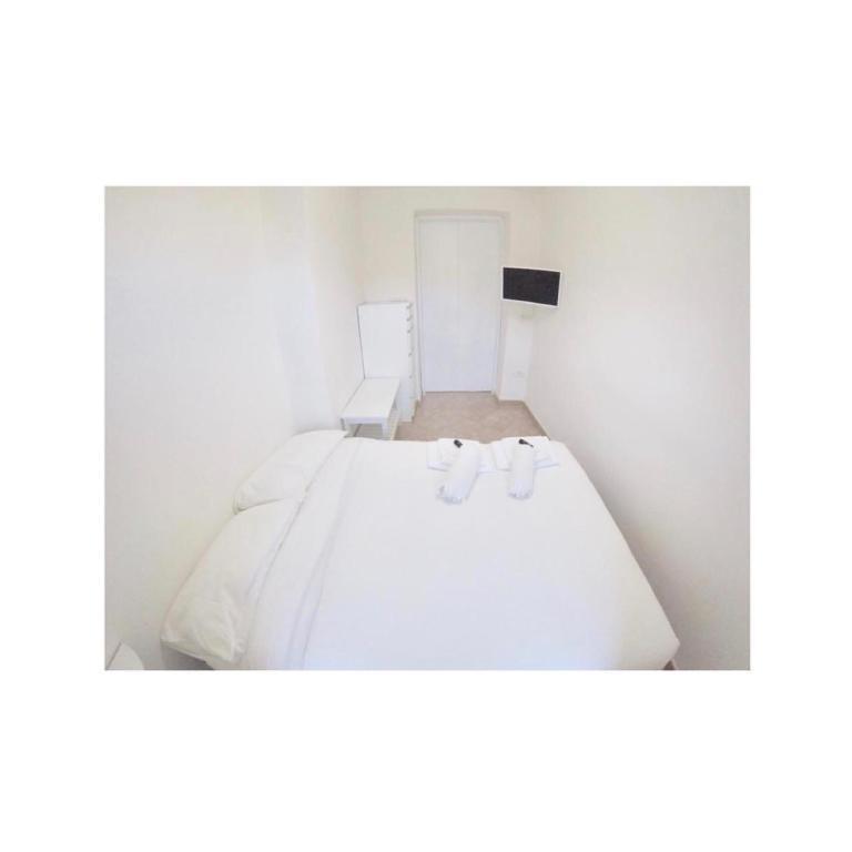 Łóżko lub łóżka w pokoju w obiekcie Secret Room Naples