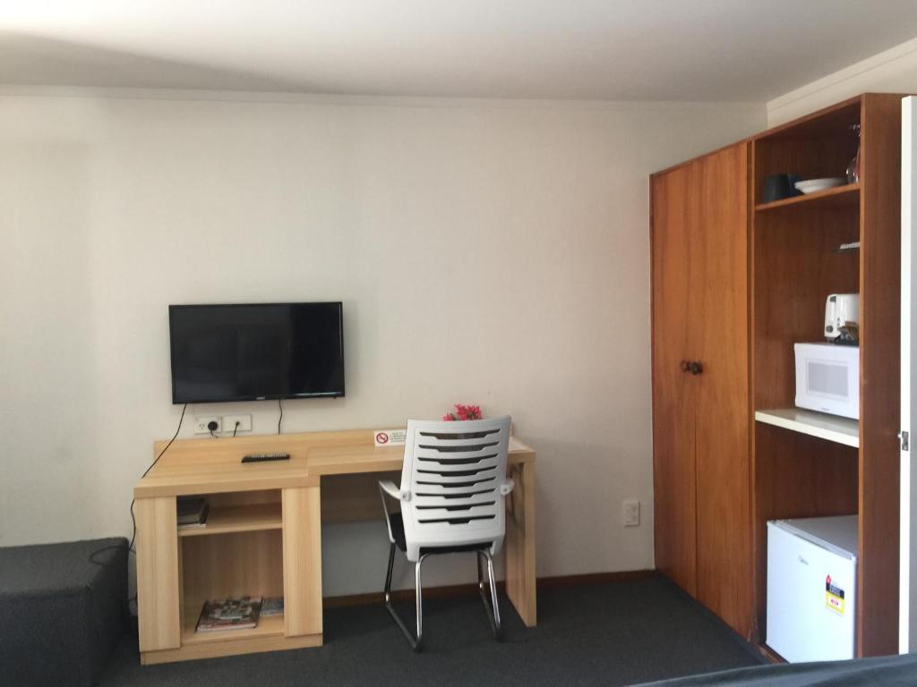 TV a/nebo společenská místnost v ubytování Grosvenor Motel