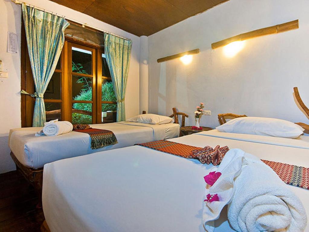 Postel nebo postele na pokoji v ubytování Bill Resort