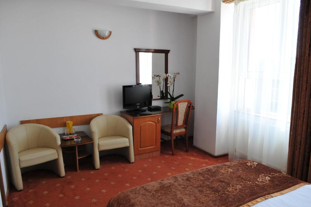 TV a/nebo společenská místnost v ubytování Hotel Emma Est