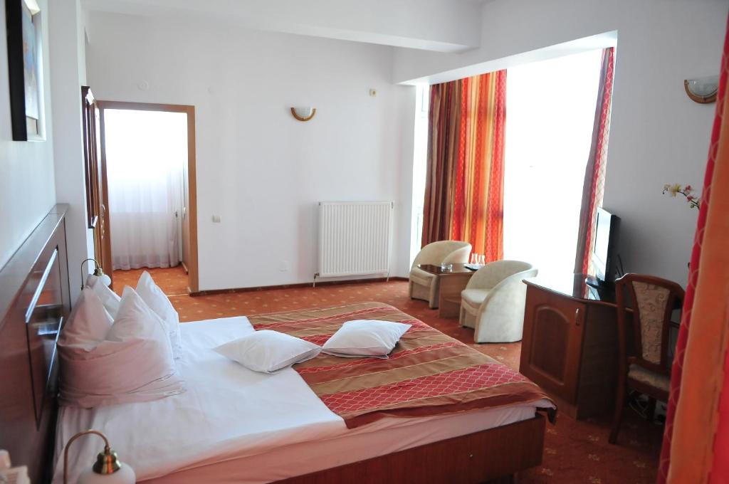 Postel nebo postele na pokoji v ubytování Hotel Emma Est