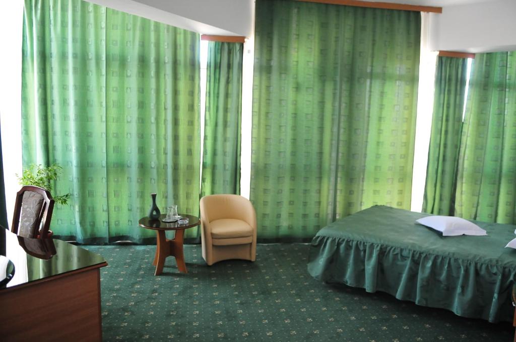 Postel nebo postele na pokoji v ubytování Hotel Emma Est