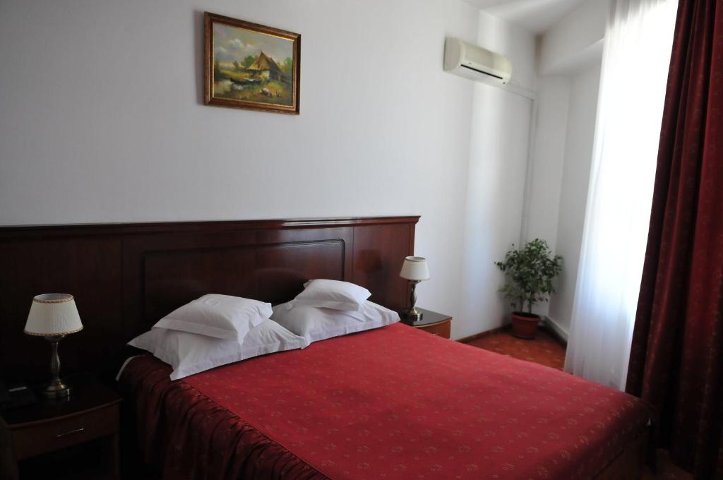 Postel nebo postele na pokoji v ubytování Hotel Emma Est