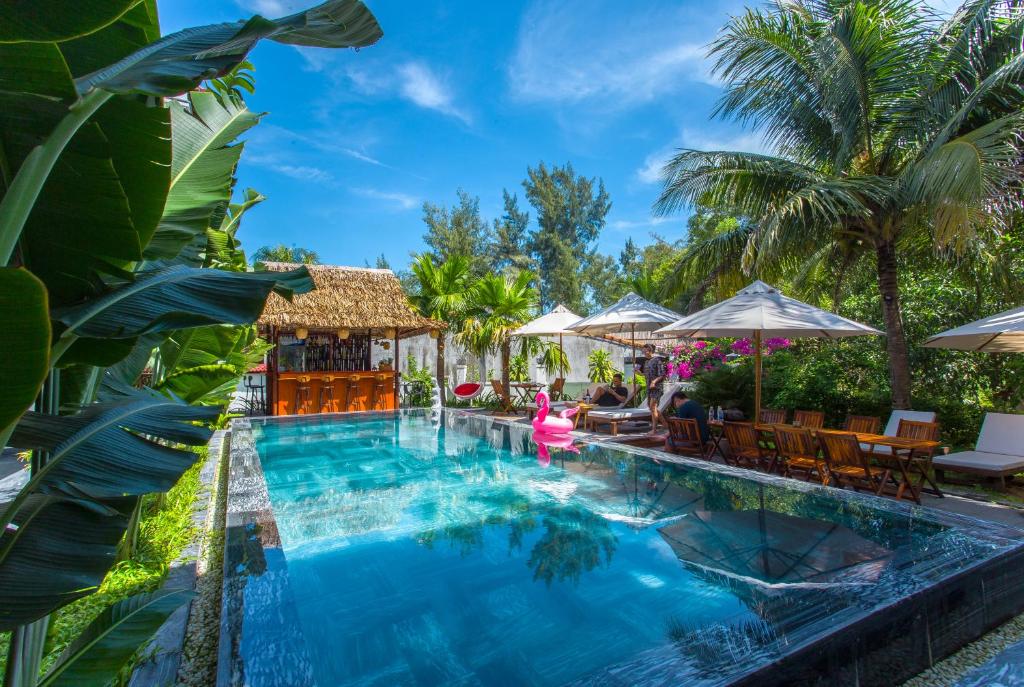a pool at the resort at The Shoreline Stay in Hoi An