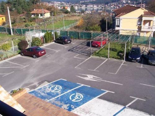 an empty parking lot with cars parked in it at Doade in Hio