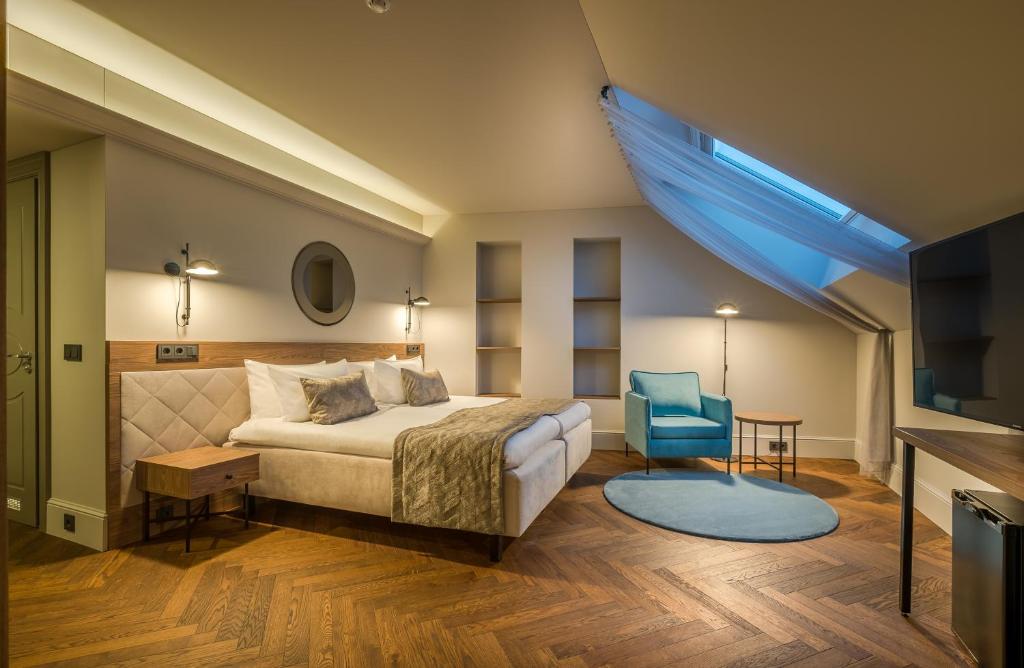 Postel nebo postele na pokoji v ubytování Hotel Vilnia