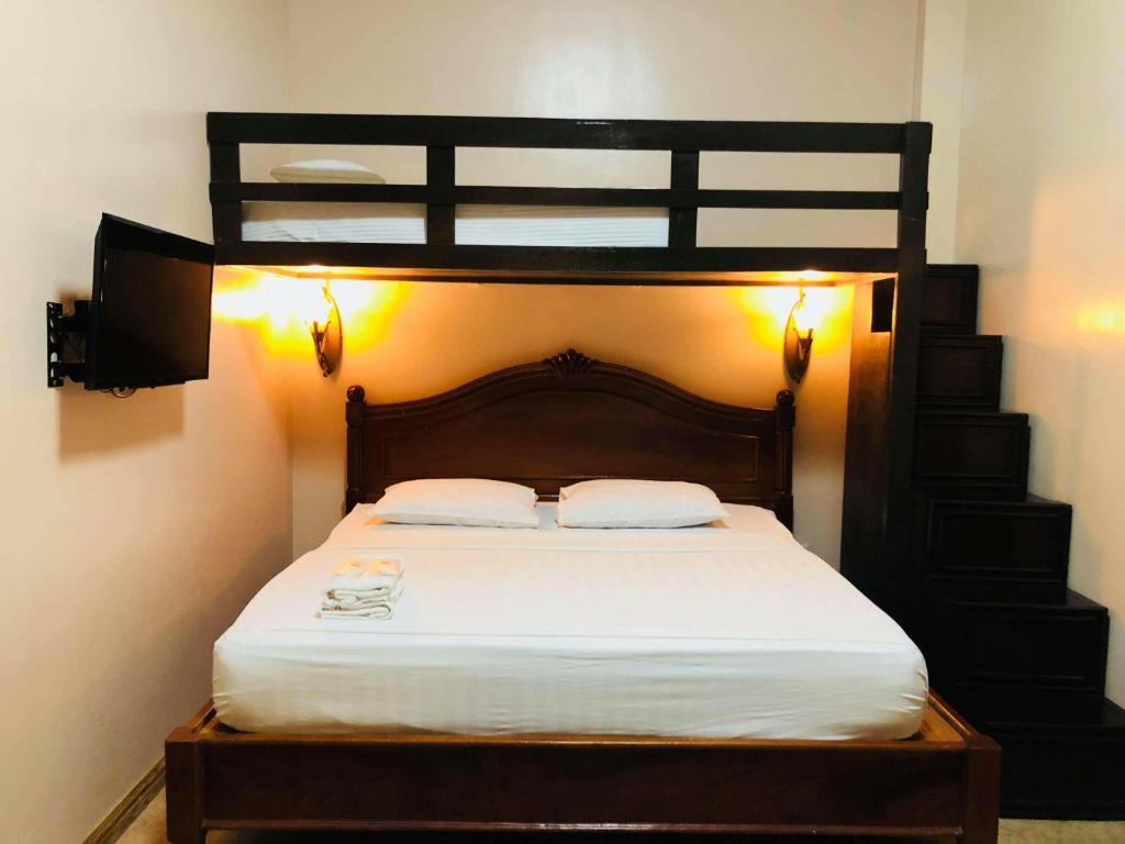Postel nebo postele na pokoji v ubytování My Vigan Home Hotel