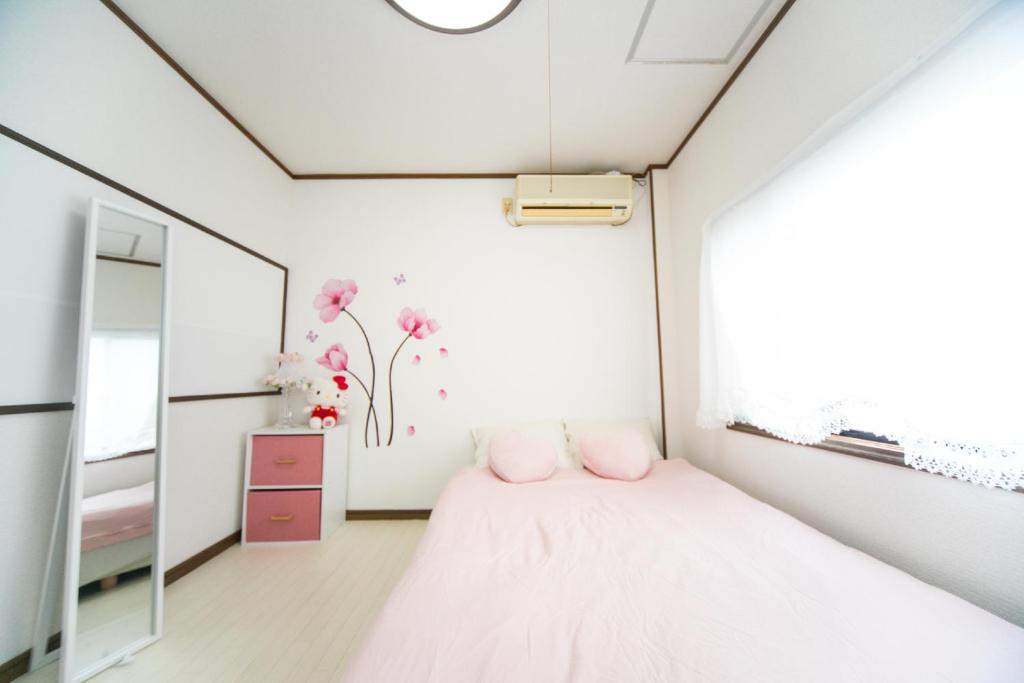 Letto o letti in una camera di Miraie Yokkaichi Kitahamacho