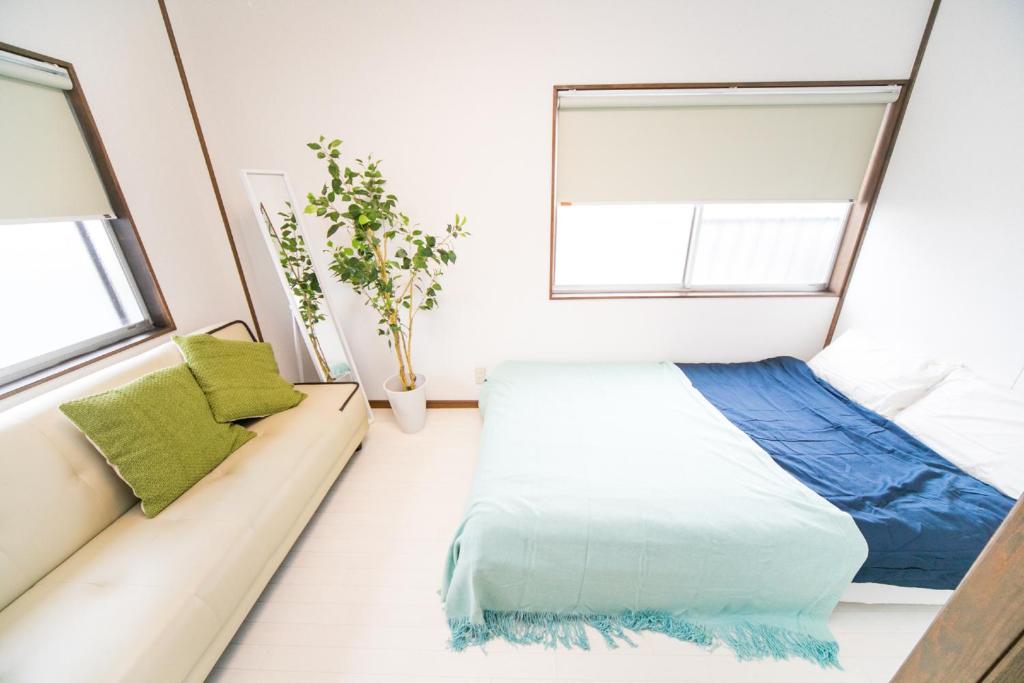 Letto o letti in una camera di Miraie Yokkaichi Kitahamacho