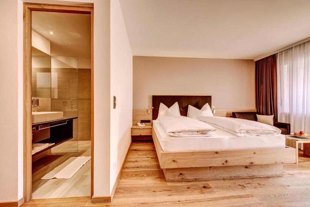 Postel nebo postele na pokoji v ubytování Hotel Lamm