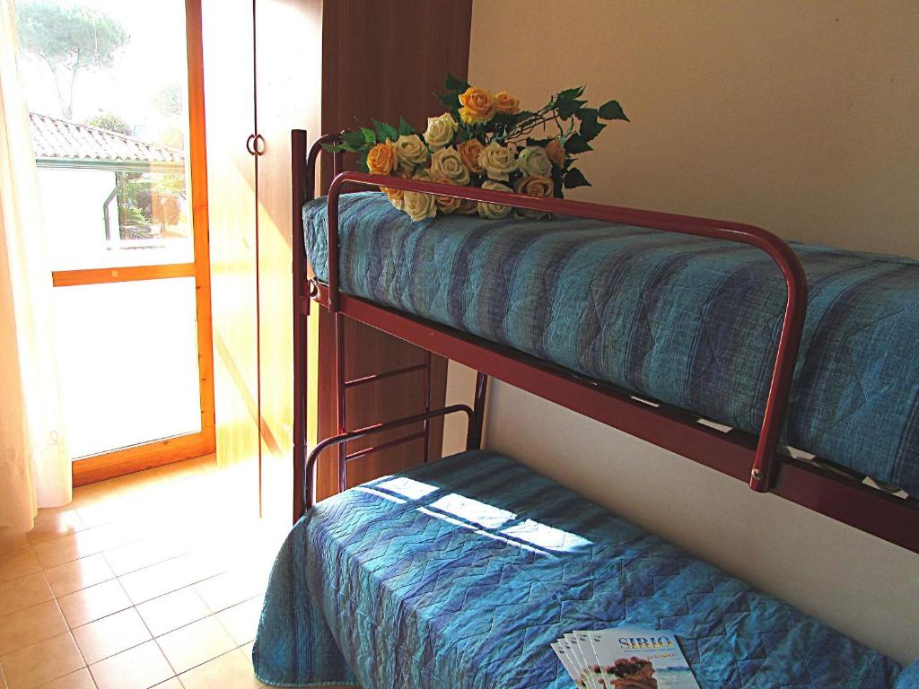 A bed or beds in a room at Andrea