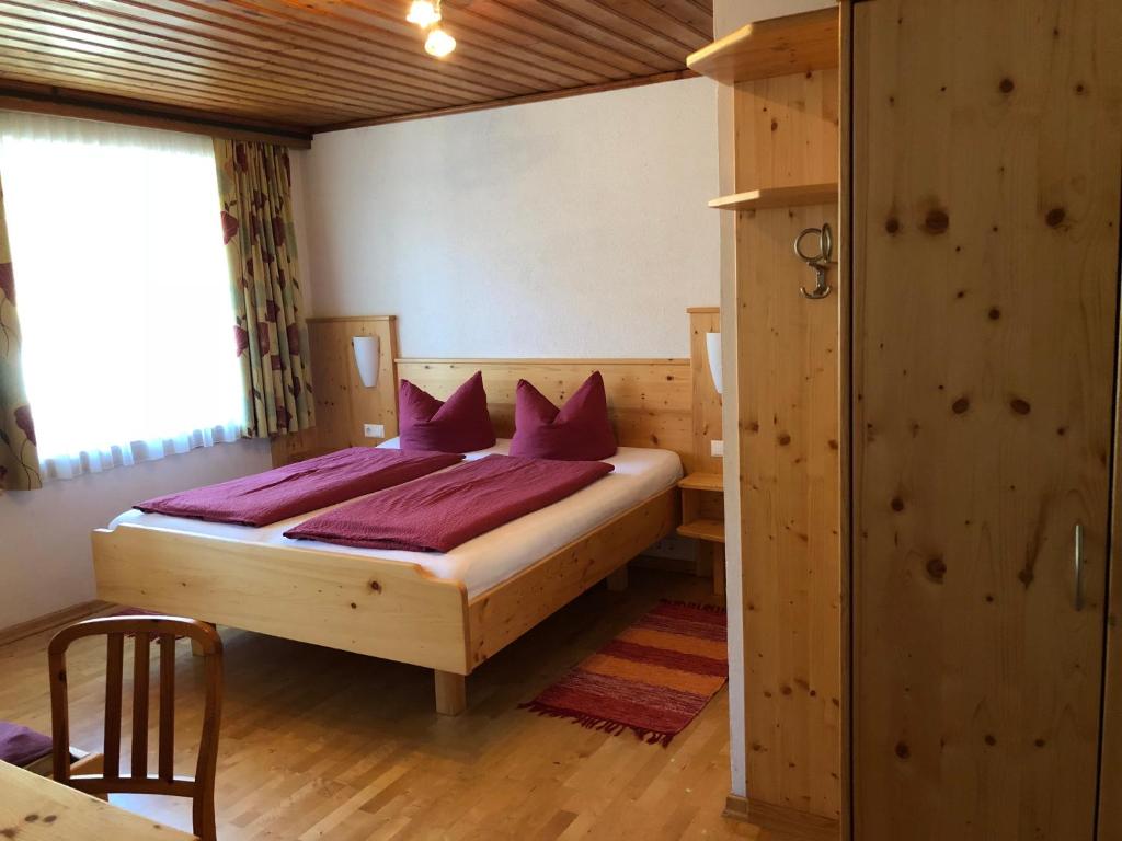 Postel nebo postele na pokoji v ubytování Pension & Ferienwohnung Dullnig