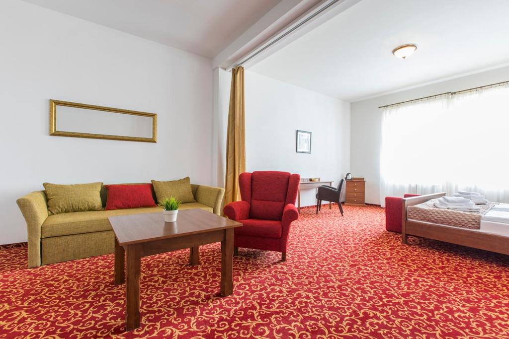 Posezení v ubytování Hotel U Zlatého kohouta