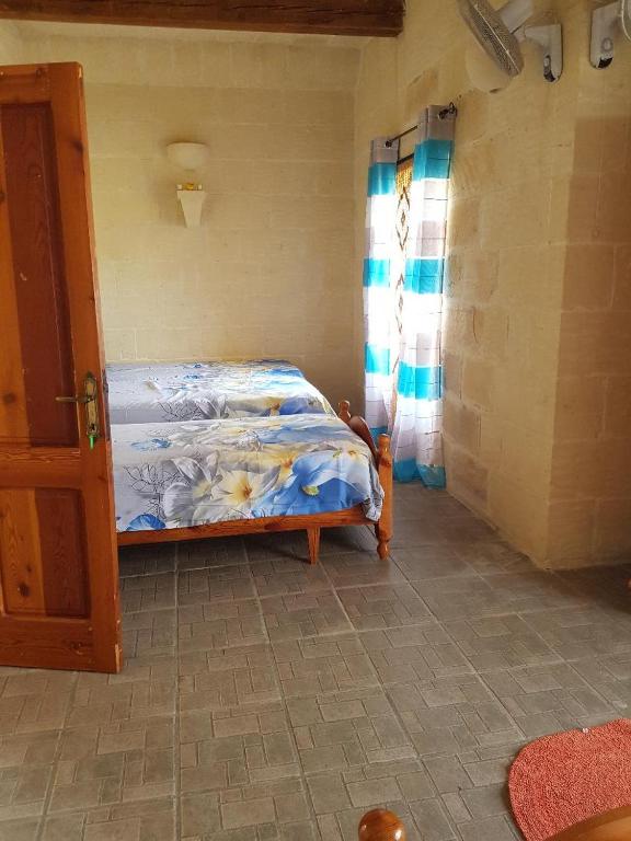 Postel nebo postele na pokoji v ubytování Ta' Karkar Villa Bed and Breakfast