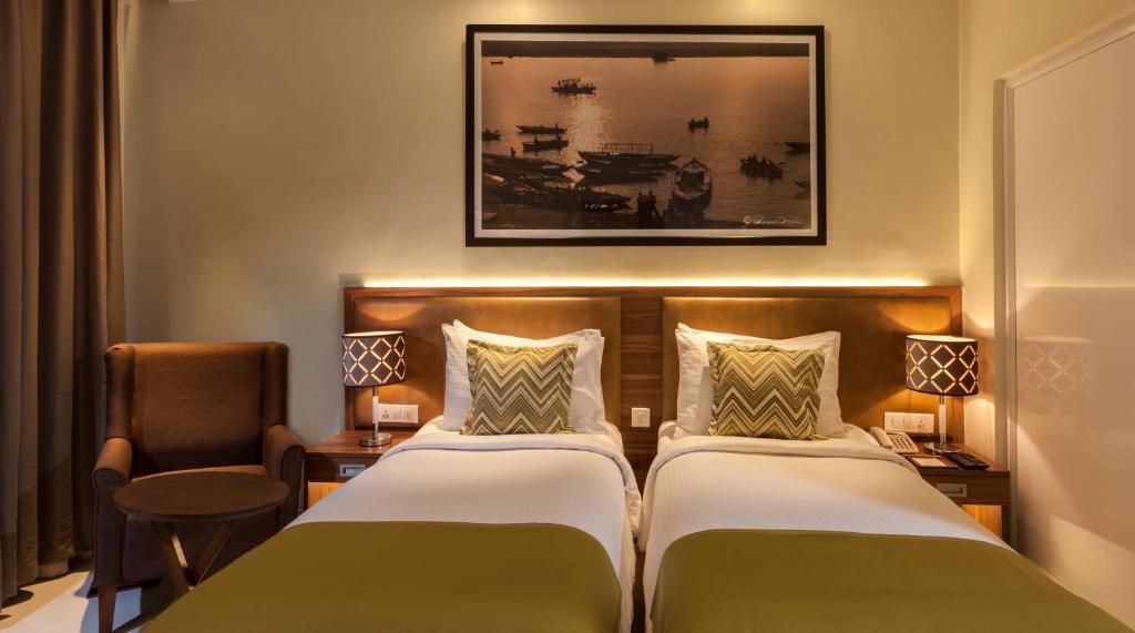 מיטה או מיטות בחדר ב-Lemon Tree Premier, Patna