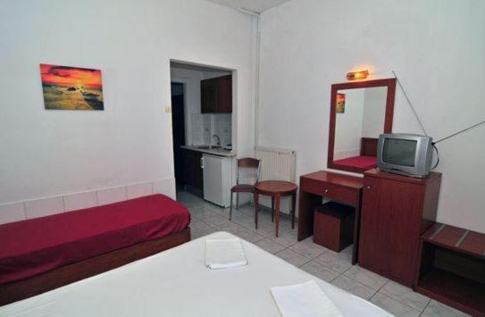 Postel nebo postele na pokoji v ubytování Chrissafis Hotel