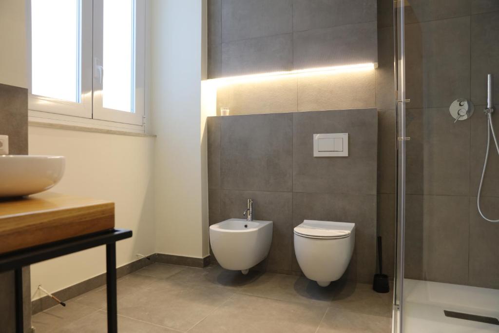 Koupelna v ubytování Teatro Suites Rooms
