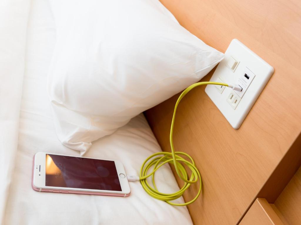 Postel nebo postele na pokoji v ubytování Super Hotel Tokyo Hamamatsucho