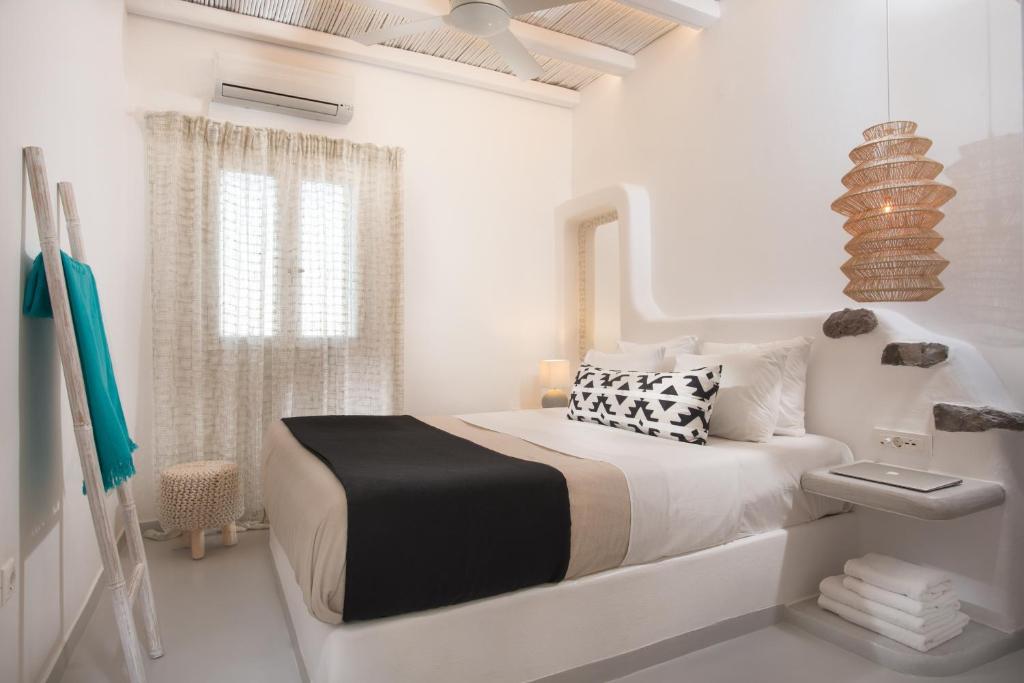 Postel nebo postele na pokoji v ubytování Perla Suites - Delmar Collection
