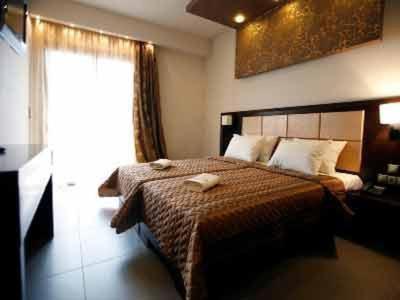 Postel nebo postele na pokoji v ubytování Dion Hotel