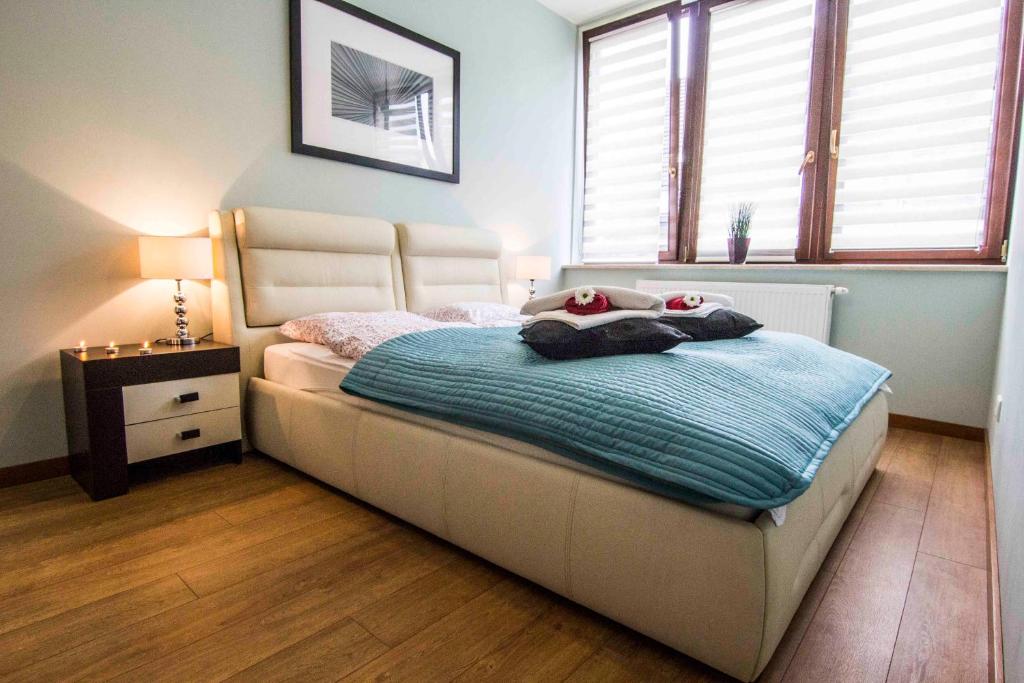 Posteľ alebo postele v izbe v ubytovaní Apartamenty Oaza Deluxe Zakopane