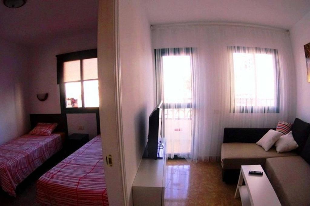 A bed or beds in a room at Céntrico apartamento 201
