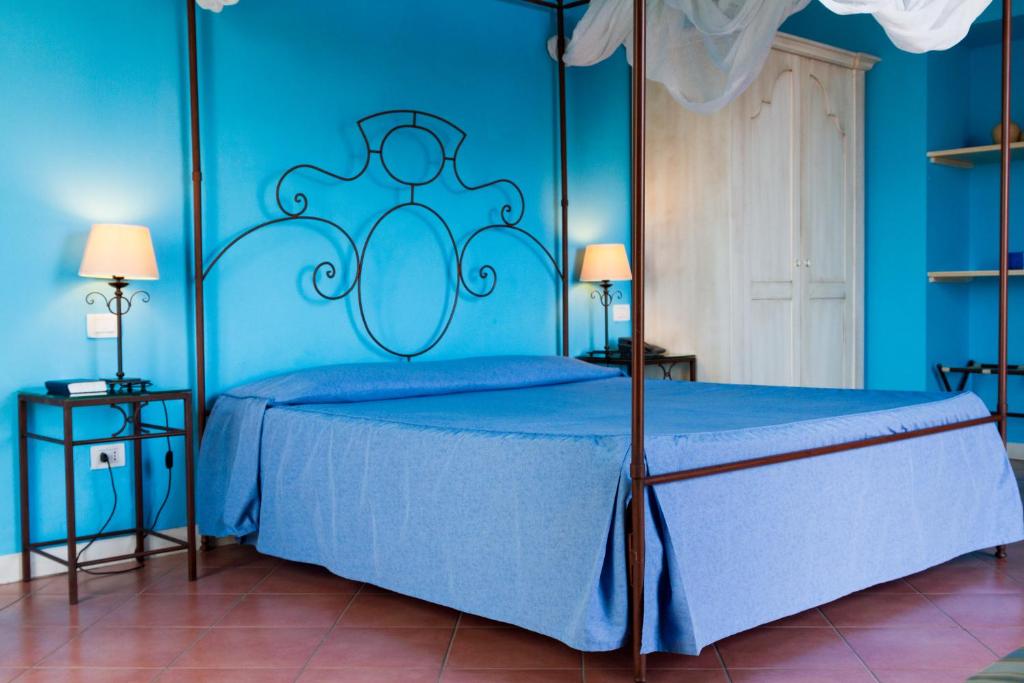 Postel nebo postele na pokoji v ubytování Etna Hotel