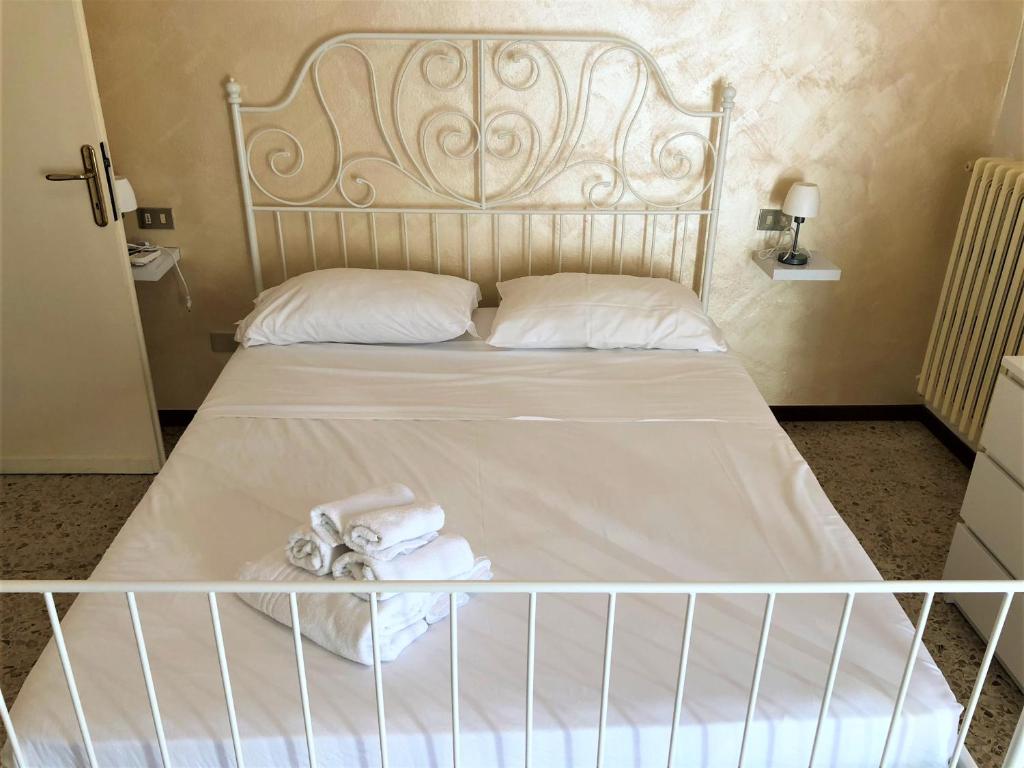 Postel nebo postele na pokoji v ubytování Isa Sirmione Apartments