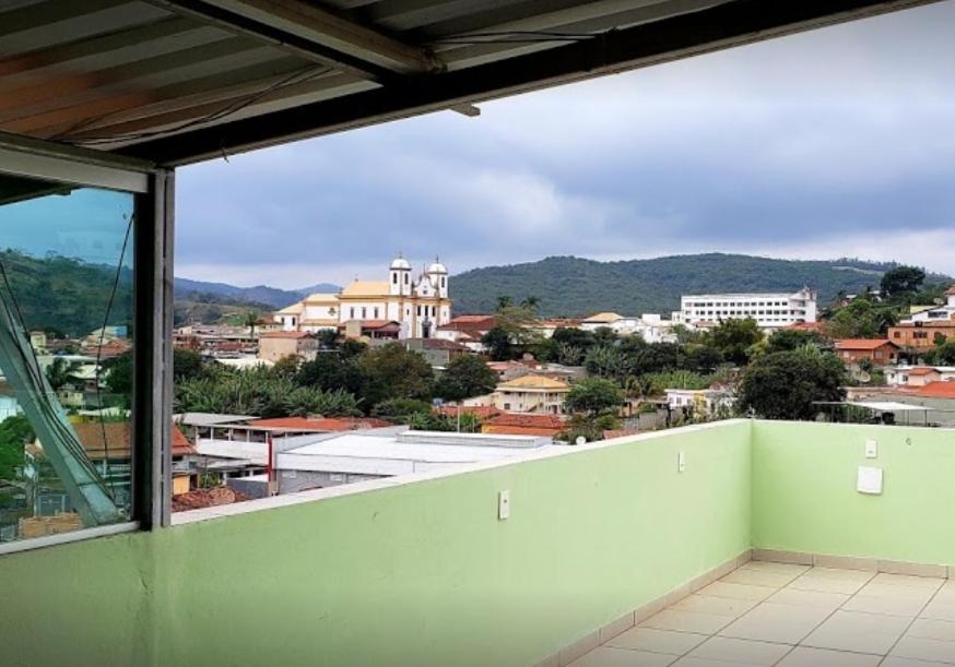 a balcony with a view of a city at Hotel Real de Caeté in Caeté