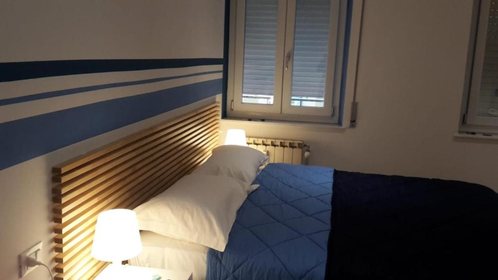 Postel nebo postele na pokoji v ubytování Parfumerie 5 Terre