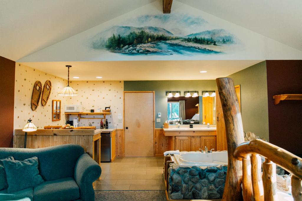 a kitchen with a couch and a sink in a room at Pine River Ranch B&B in Leavenworth