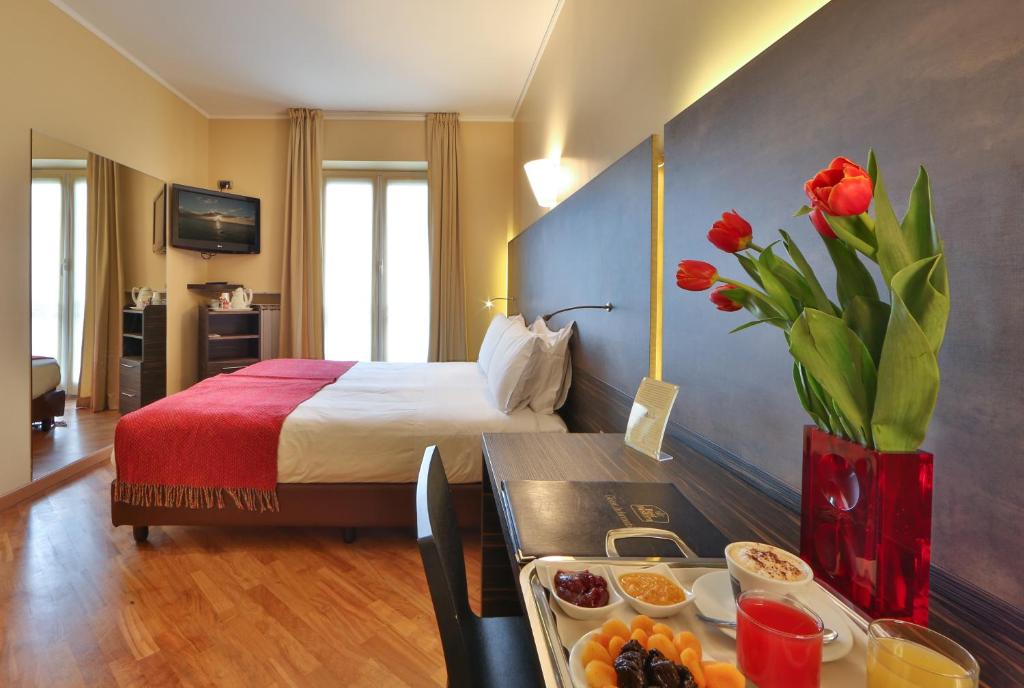Postel nebo postele na pokoji v ubytování Best Western Hotel Metropoli