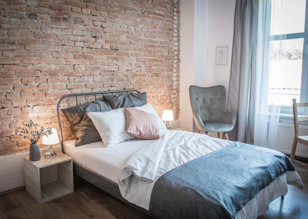 Posteľ alebo postele v izbe v ubytovaní LION apartments - SILVER