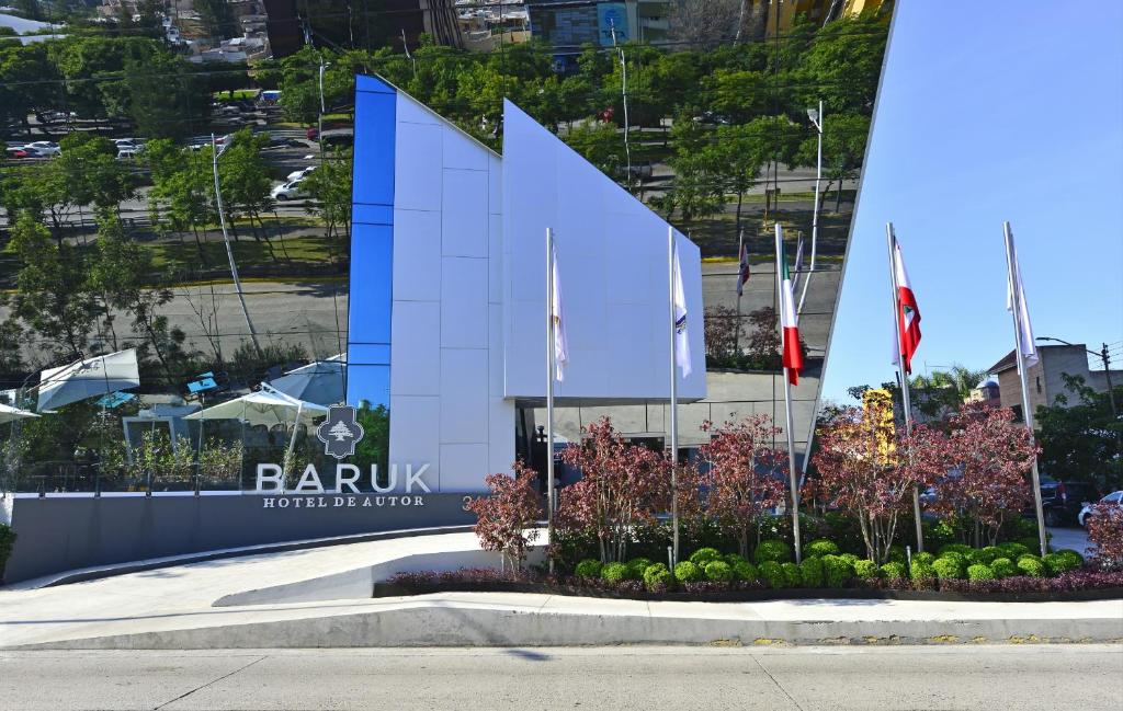 a building with a sign in front of it at Baruk Guadalajara Hotel de Autor in Guadalajara