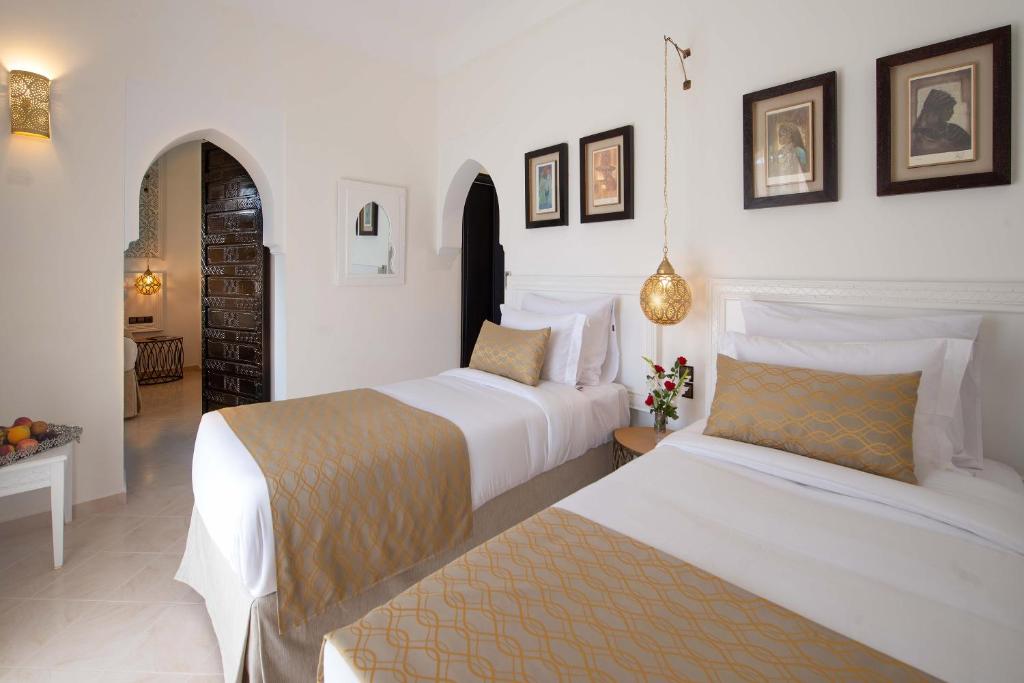 Postel nebo postele na pokoji v ubytování Marrakech Ryads Parc All inclusive