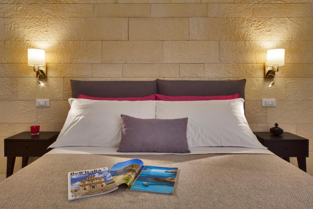 Postel nebo postele na pokoji v ubytování Sciala Ortigia B&B