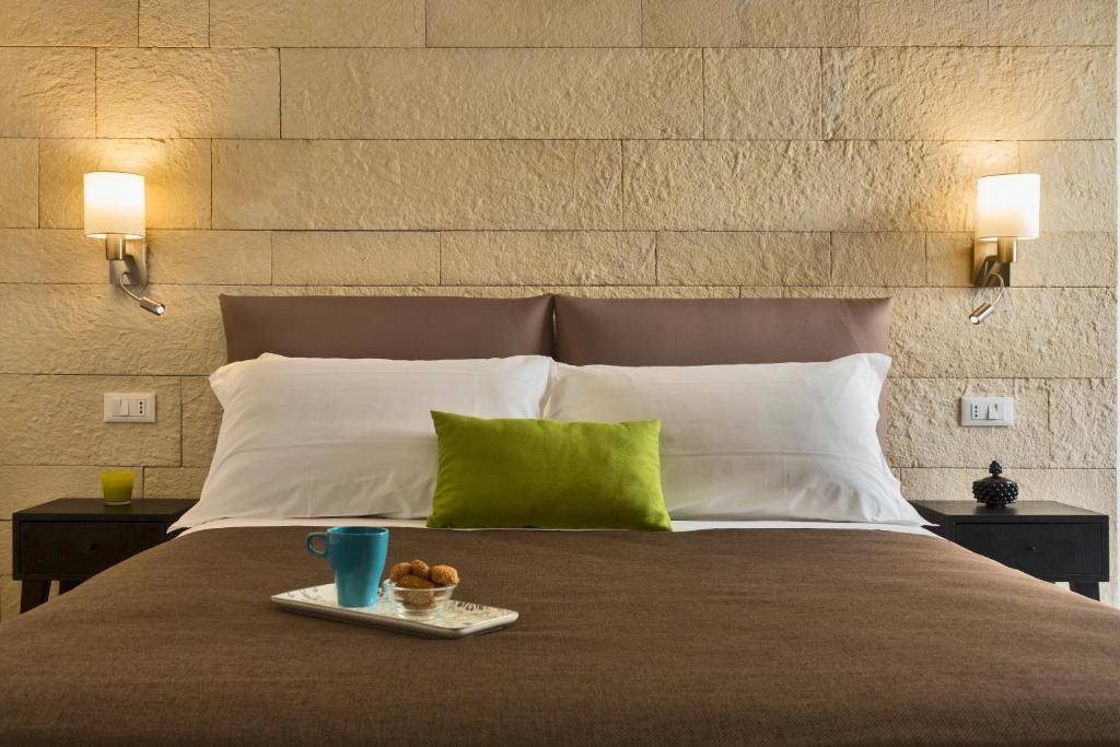 Postel nebo postele na pokoji v ubytování Sciala Ortigia B&B