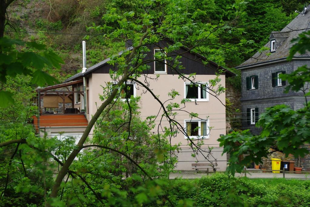 a white house with a black roof at Ferienwohnung Bacharach in Bacharach
