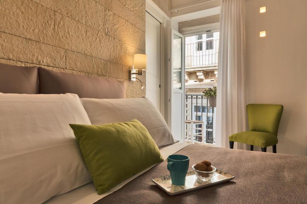 Postel nebo postele na pokoji v ubytování Sciala Ortigia B&B