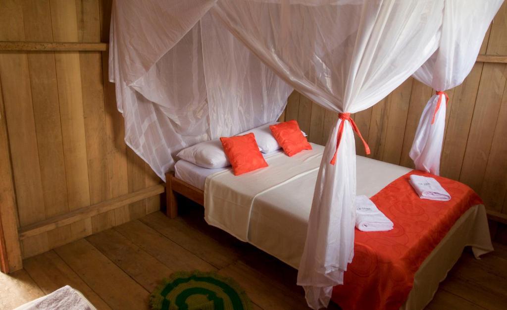Postel nebo postele na pokoji v ubytování La Ceiba, Amazonas