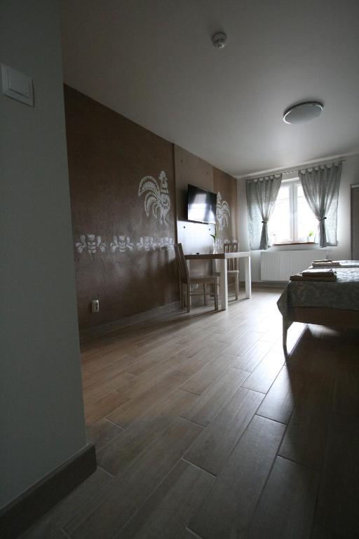 TV a/nebo společenská místnost v ubytování Noclegi Cameleon