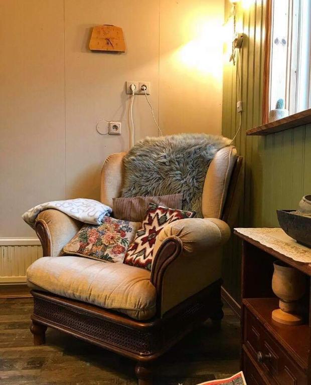 a couch sitting in the corner of a room at Litlabjarg Guesthouse in Hrafnabjorg