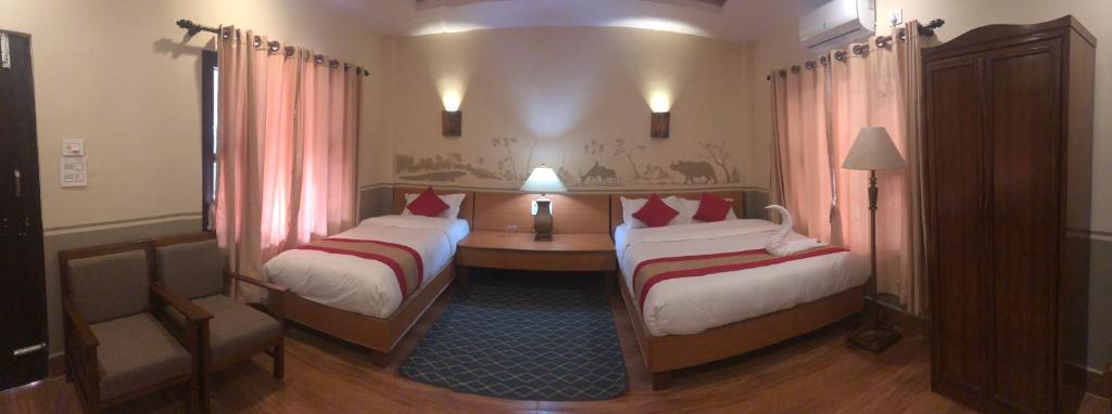 Postel nebo postele na pokoji v ubytování Jungle Safari Resort