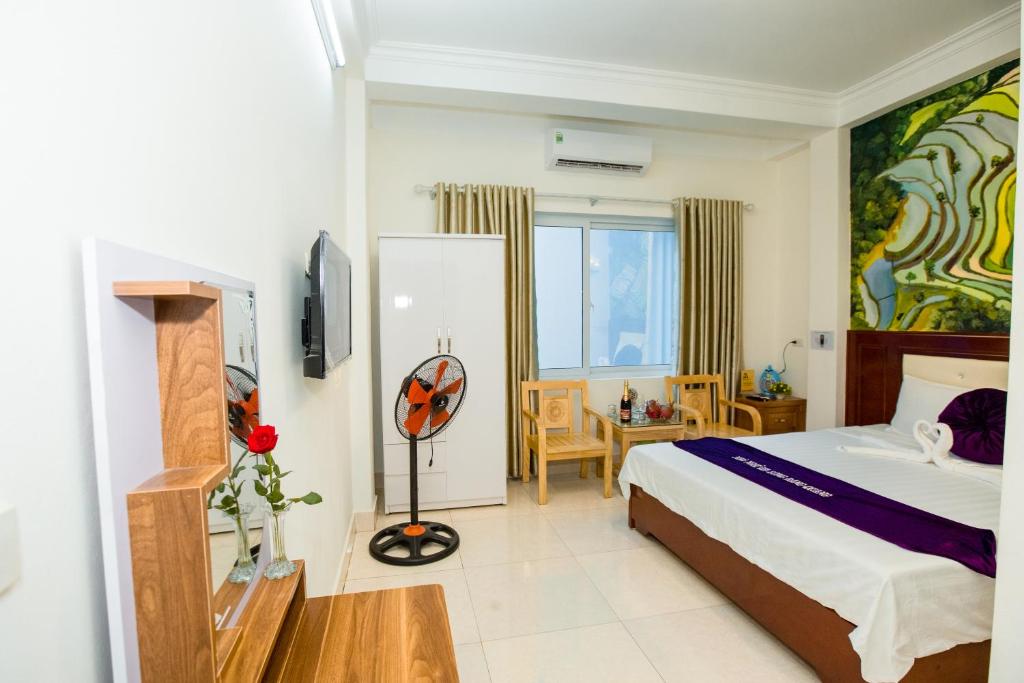 Postel nebo postele na pokoji v ubytování Dang Quang Guesthouse