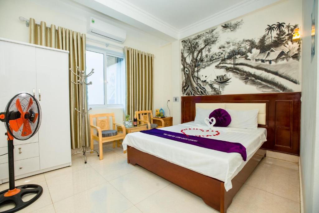 Postel nebo postele na pokoji v ubytování Dang Quang Guesthouse